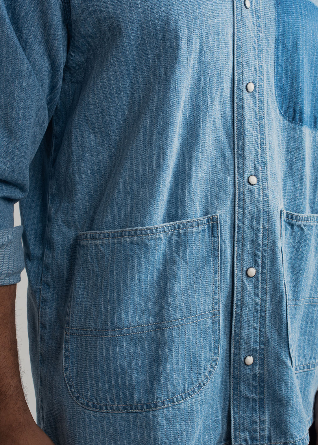 Men's blue striped denim shirt with vertical stripes and relaxed styling
