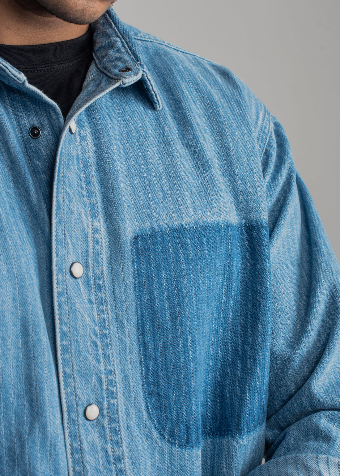 Men's blue striped denim shirt with vertical stripes and relaxed styling