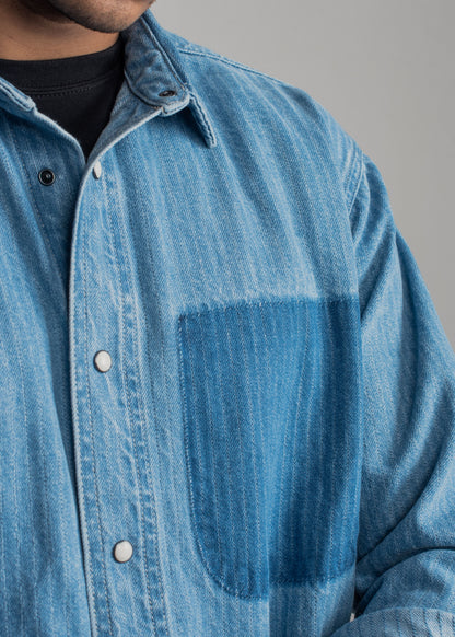 Men's blue striped denim shirt with vertical stripes and relaxed styling