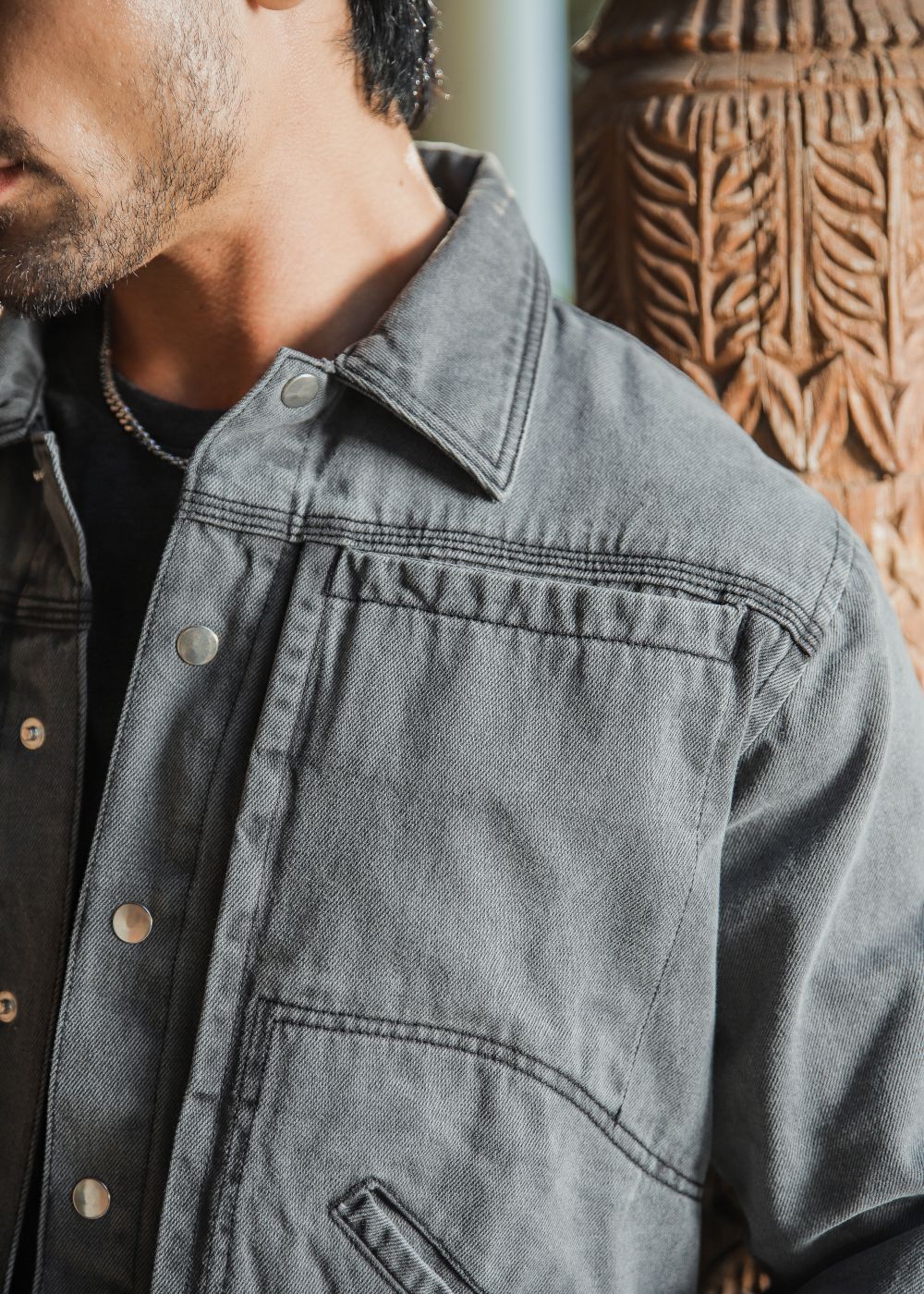 Men's grey denim jacket with button front and chest pockets