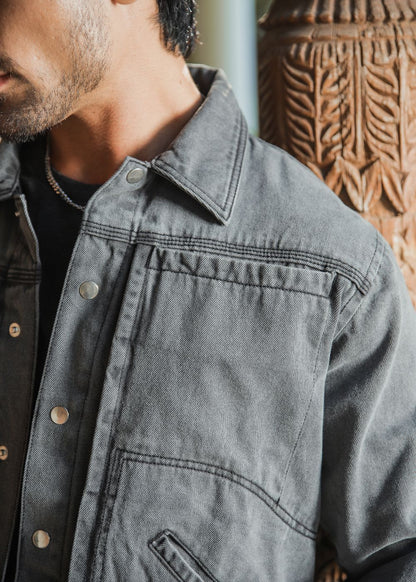 Men's grey denim jacket with button front and chest pockets