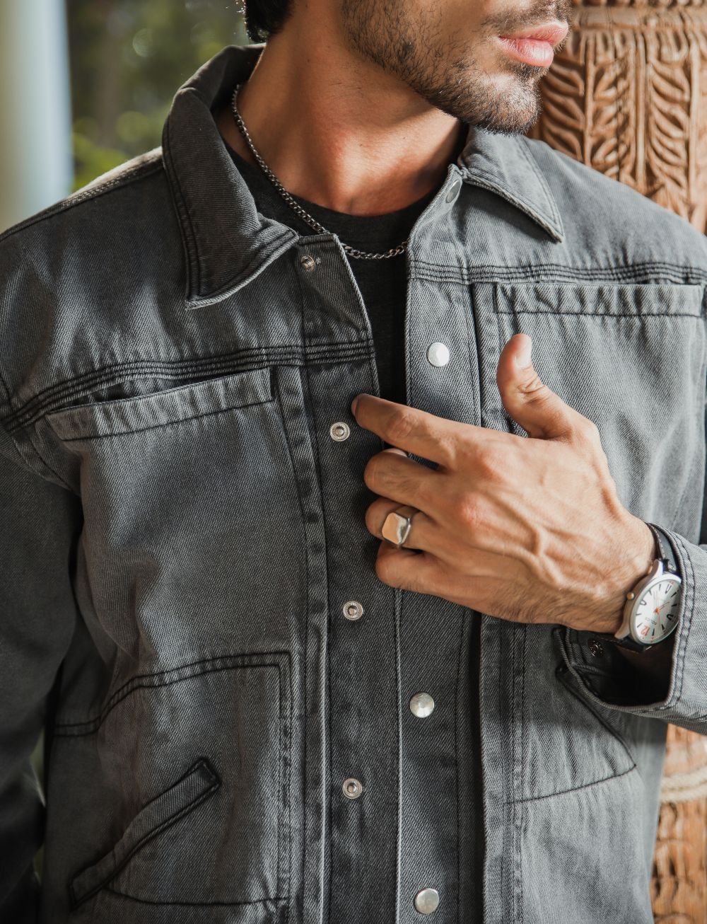 Men's grey denim jacket with button front and chest pockets
