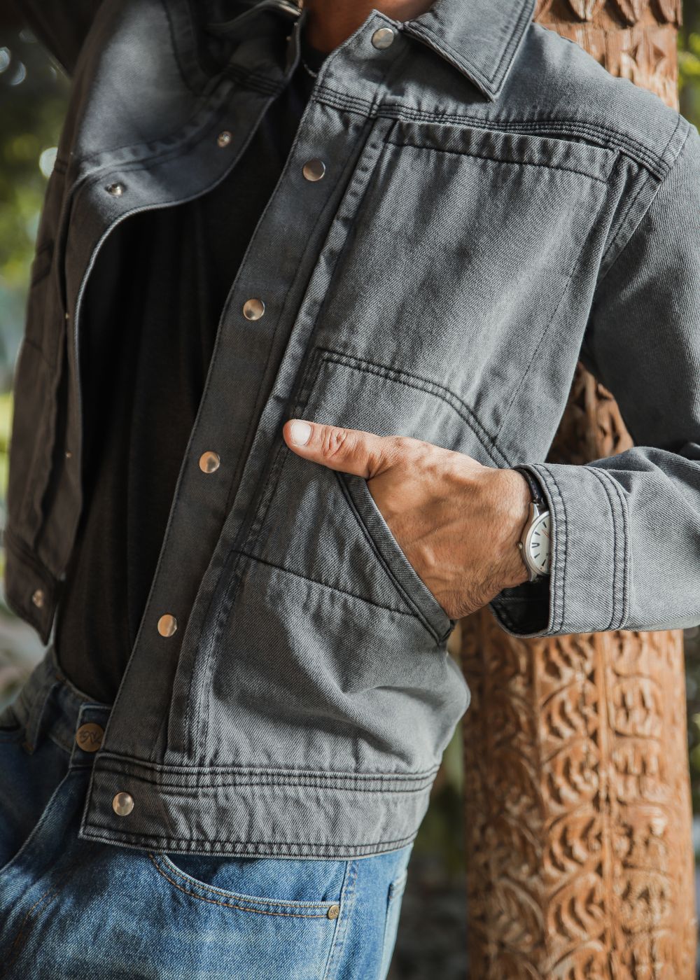 Men's grey denim jacket with button front and chest pockets