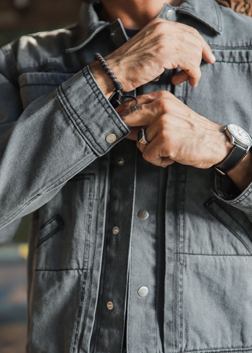 Men's grey denim jacket with button front and chest pockets