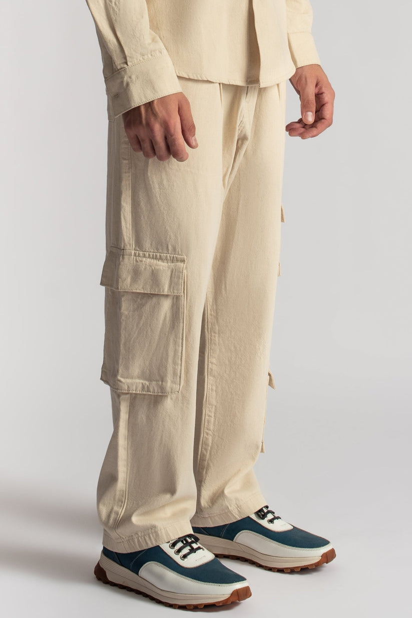 Men’s relaxed fit beige cargo pants with oversized utility pocket detailing