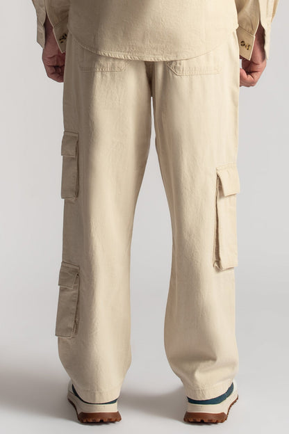 Men’s relaxed fit beige cargo pants with oversized utility pocket detailing