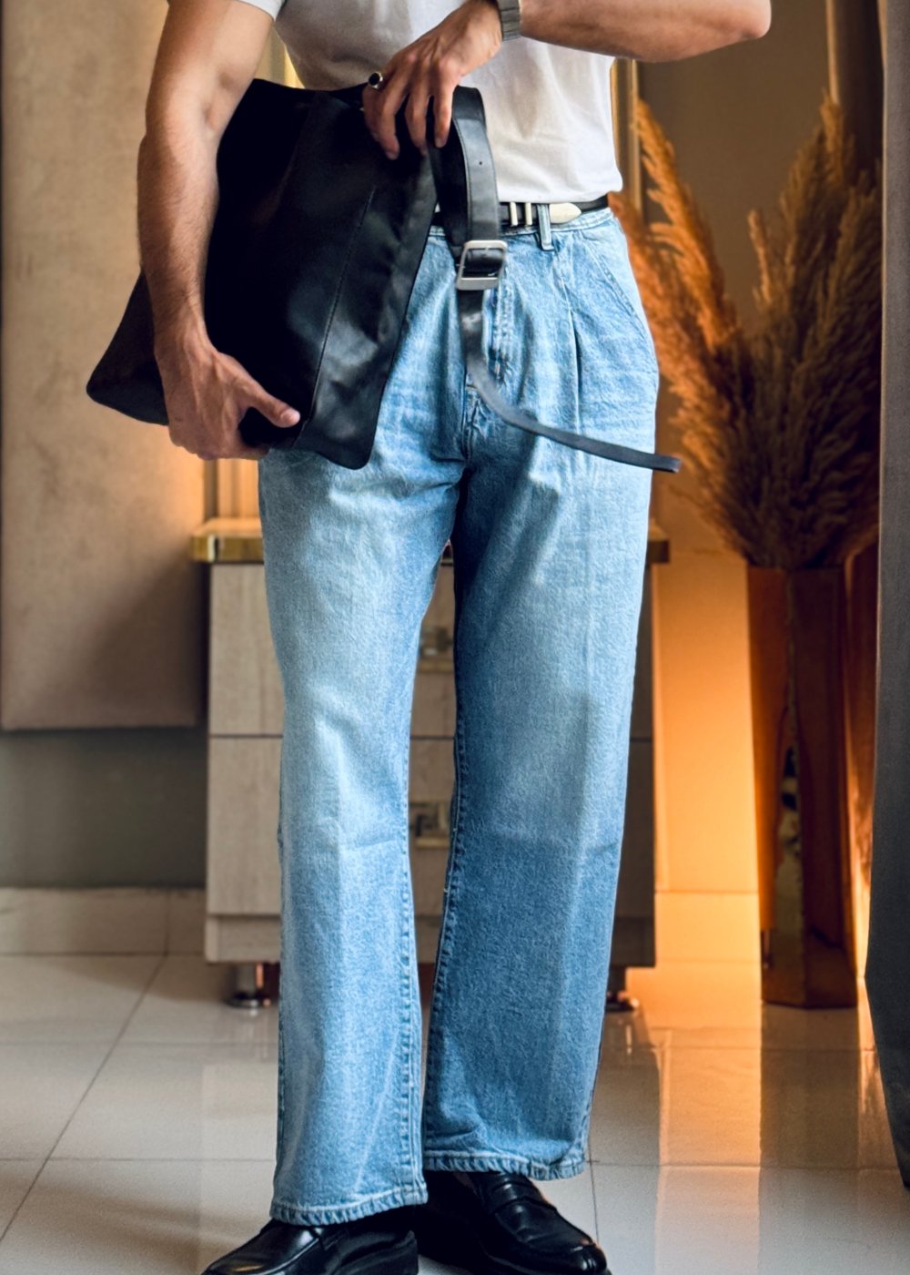 Men's relaxed fit light blue pleated jeans with wide leg silhouette