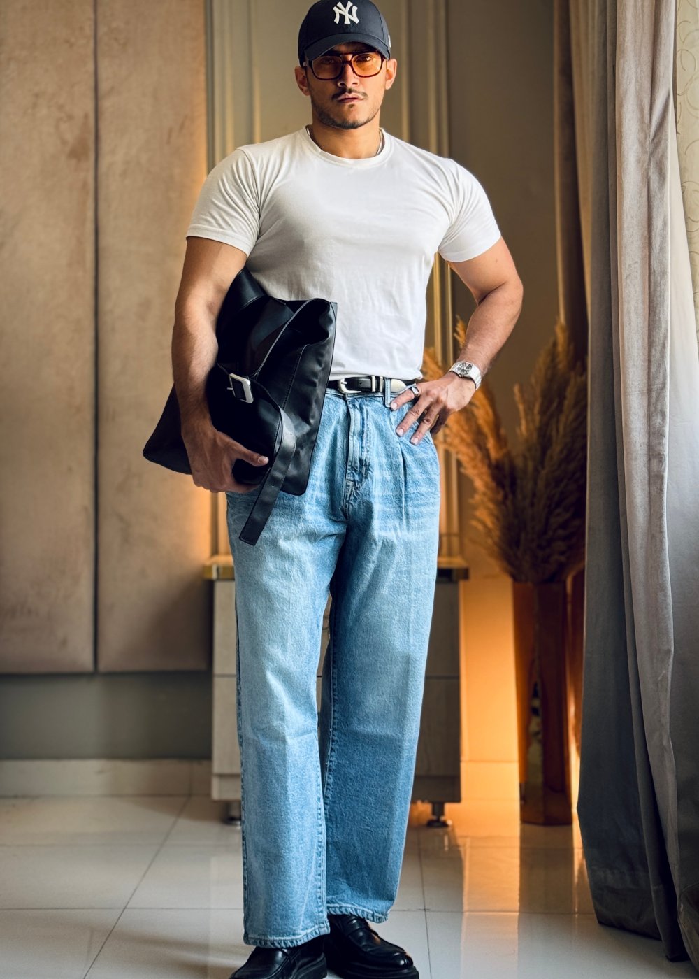 Men's relaxed fit light blue pleated jeans with wide leg silhouette