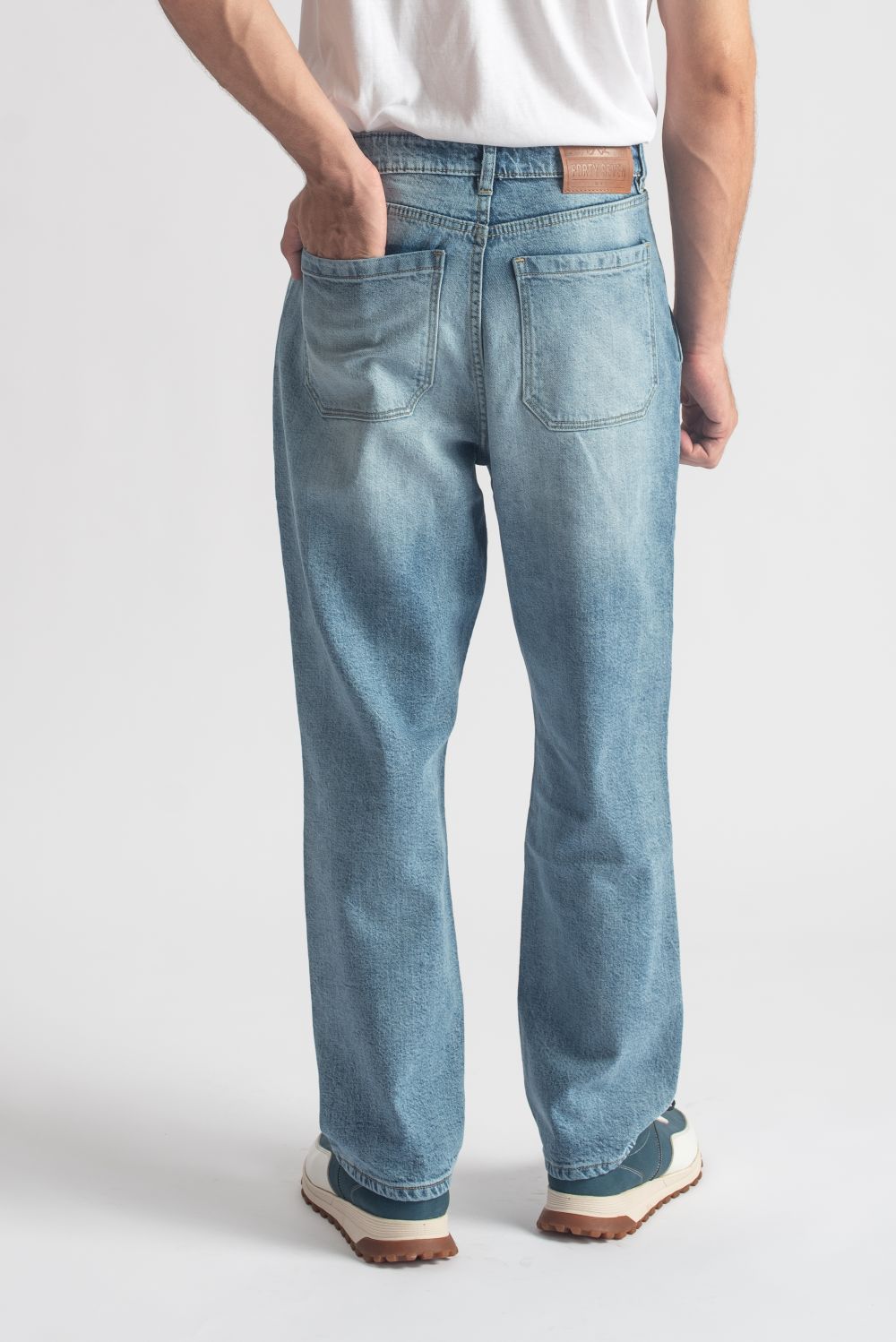 Men's relaxed fit light blue pleated jeans with wide leg silhouette