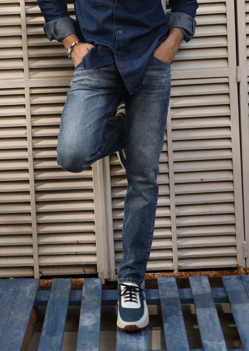 Men’s slim fit acid wash blue jeans with distressed vintage finish