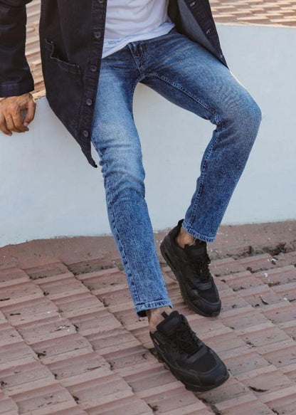 Men’s slim fit acid wash blue jeans with distressed vintage finish