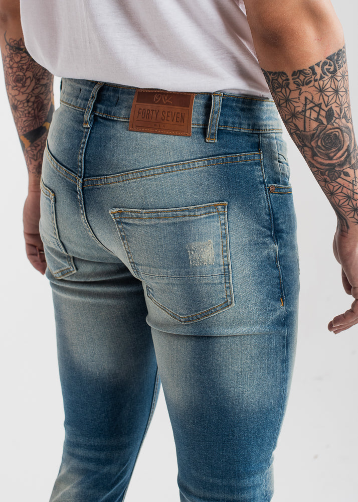 sand-blasted light blue skinny ripped jeans men low-rise stretch denim