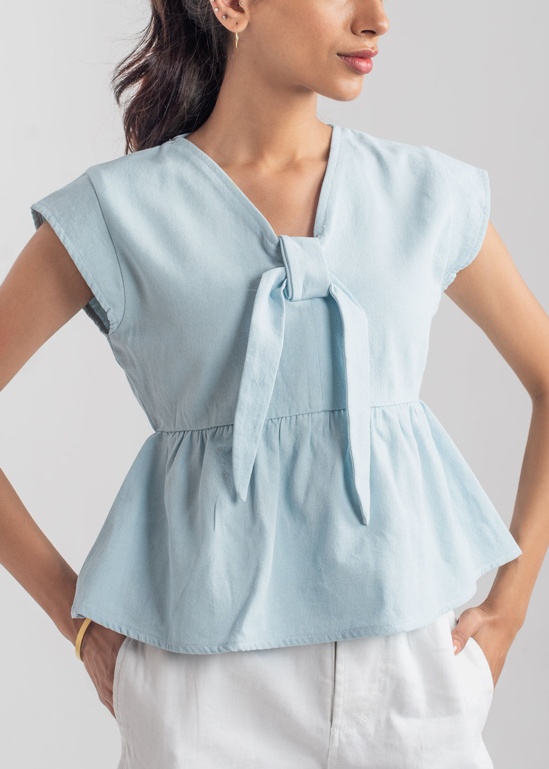 Women's Peplum Top in Pastel Blue with a Bow in Front