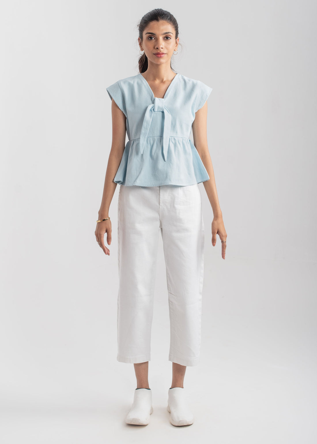 Women's Peplum Top in Pastel Blue with a Bow in Front