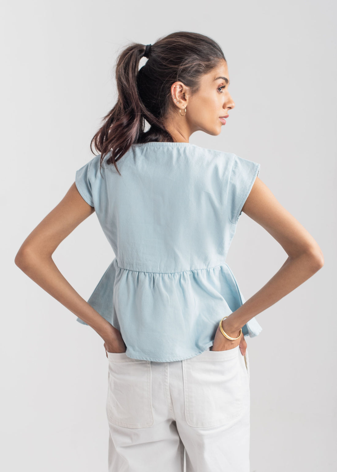 Women's Peplum Top in Pastel Blue with a Bow in Front