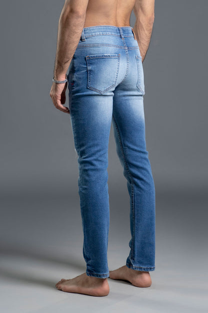 Men's light blue ripped and repaired skinny jeans
