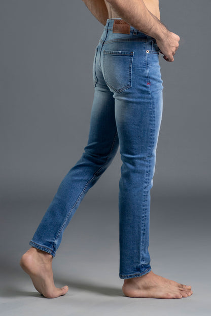 Men's light blue ripped and repaired skinny jeans