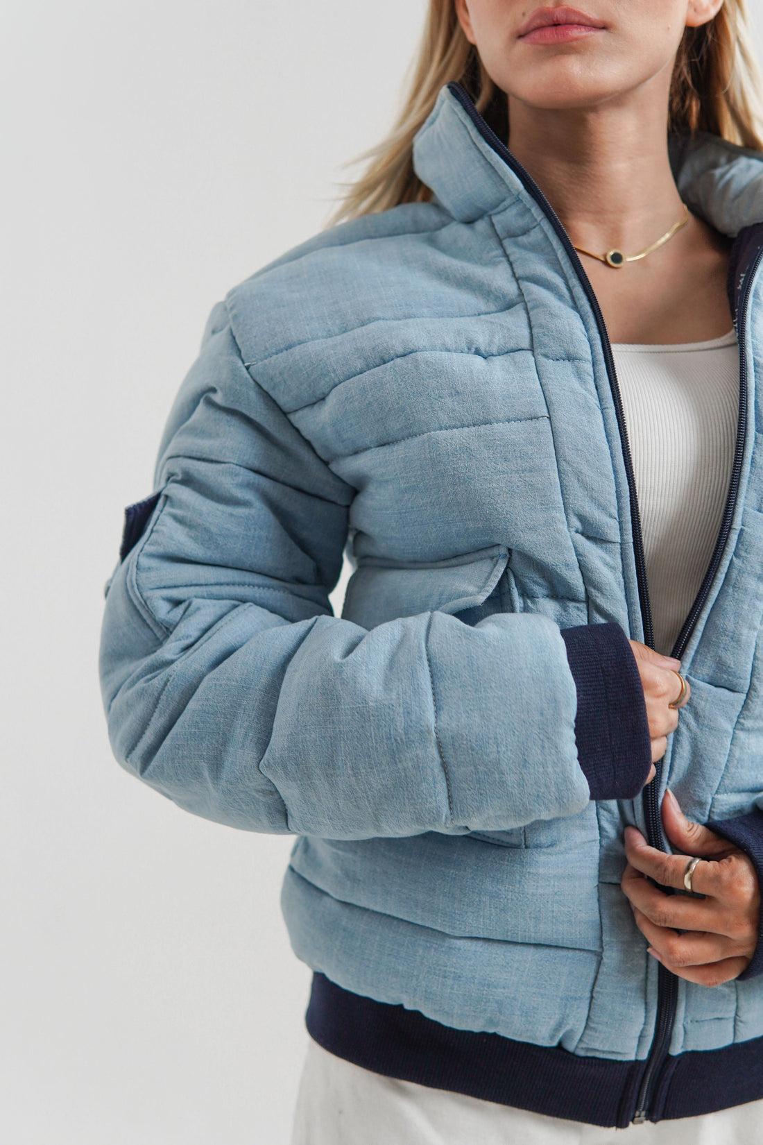 Ladies blue puffer jacket with collar and cuffs