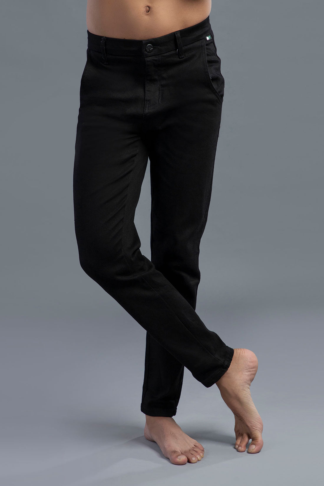 Men’s black skinny fit jeans with stretch fabric and tapered ankle design