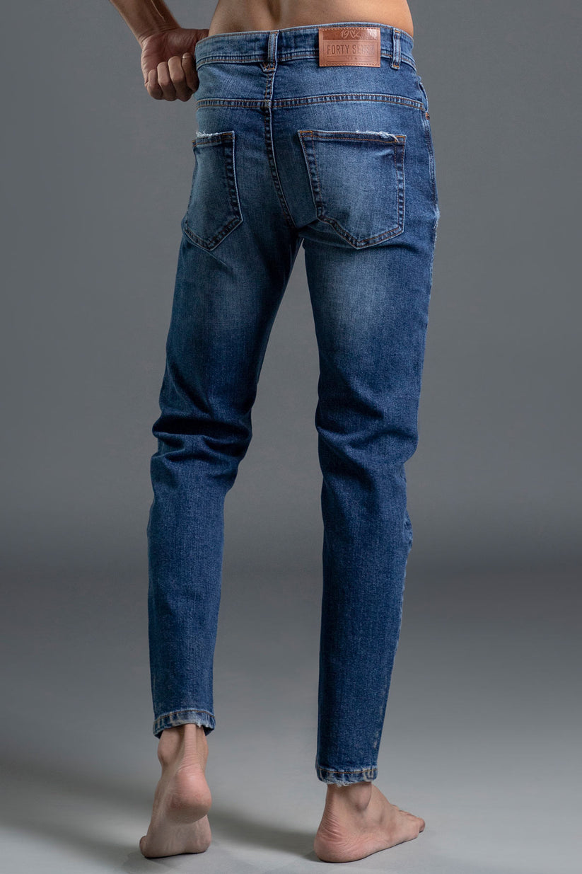 Men's Blue Ripped Jeans with a mid-rise waist and ripped details.