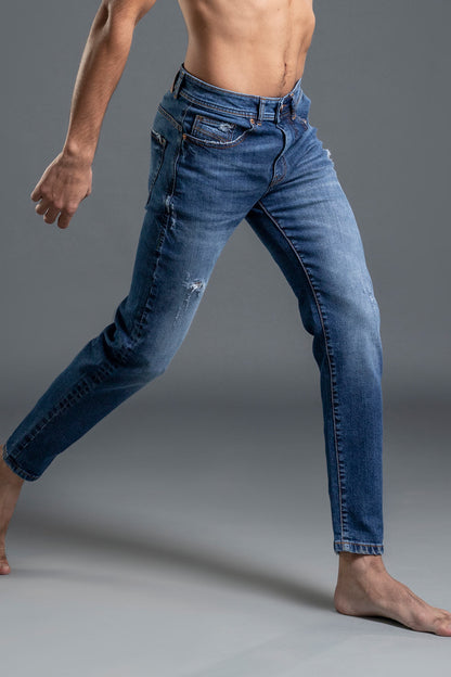 Men's Blue Ripped Jeans with a mid-rise waist and ripped details.