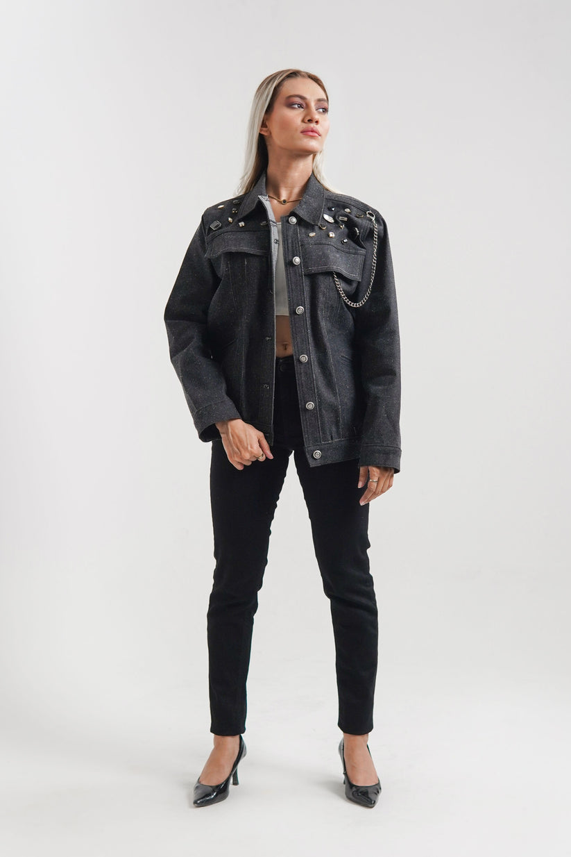 women's black denim jacket with a collared neckline and button details