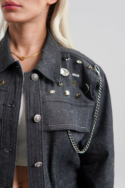 women's black denim jacket with a collared neckline and button details