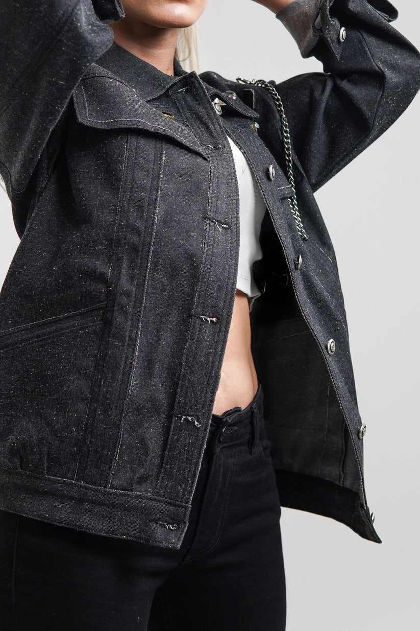 women's black denim jacket with a collared neckline and button details