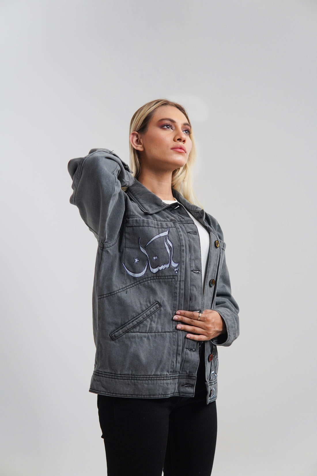 Women's denim jacket in grey with a slogan on the front and back