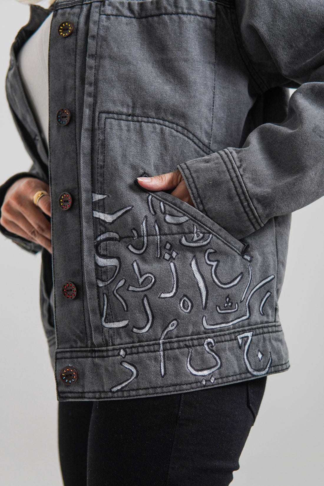 Women's denim jacket in grey with a slogan on the front and back